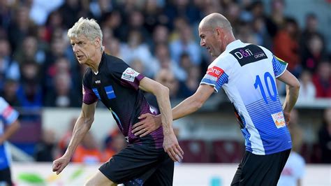 Arsene Wenger dribbles past Zinedine Zidane at .